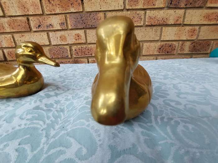 TWO SOLID BRASS DUCKS  SOLD AS IS