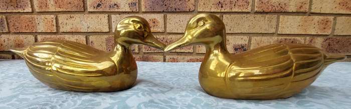 TWO SOLID BRASS DUCKS  SOLD AS IS