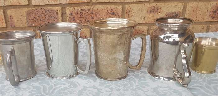 A COLLECTION OF BEER MUGS SOLD AS IS