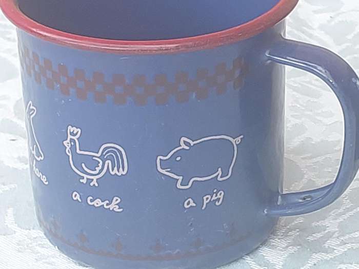 TWO ENAMEL COFFEE CUPS SOLD AS IS