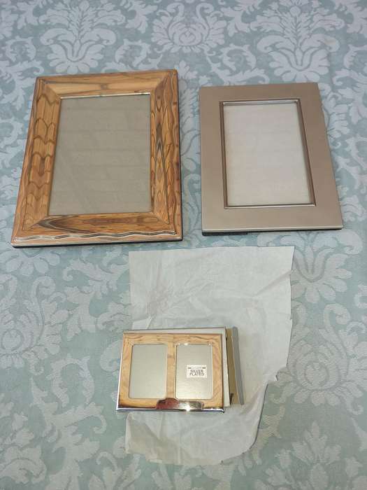 A COLLECTION OF PHOTO FRAMES SOLD AS IS