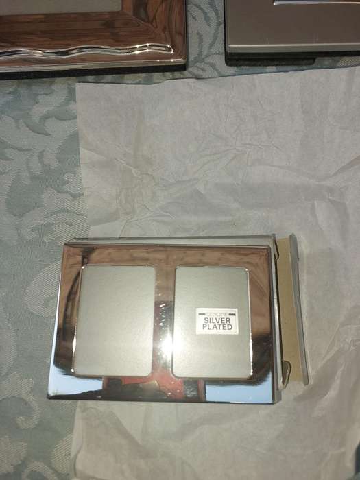 A COLLECTION OF PHOTO FRAMES SOLD AS IS