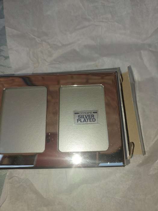 A COLLECTION OF PHOTO FRAMES SOLD AS IS