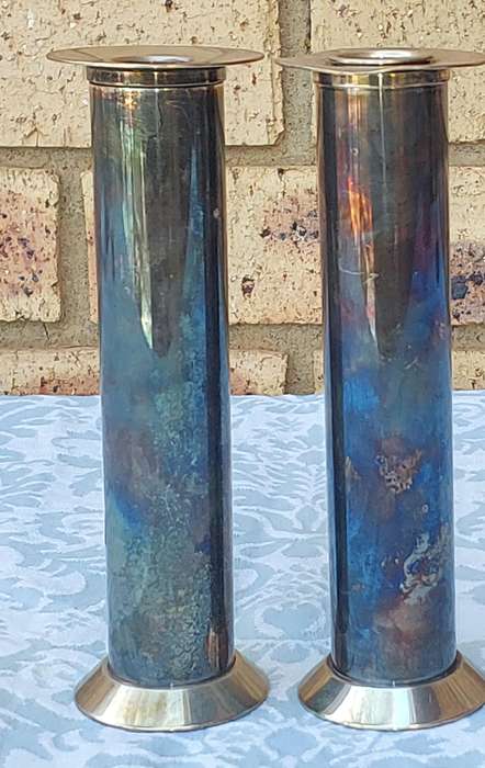 A PAIR OF SILVER PLATED ART DECOR  CANDLE HOLDERS SOLD AS IS