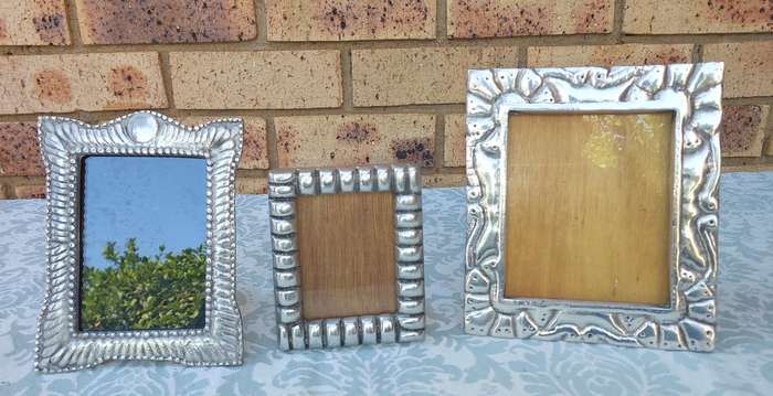 A COLLECTION OF PEWTEL PHOTO FRAMES MADE IN MEXICO SOLD AS IS