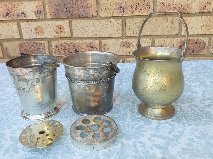 A COLLECTION OF VINTAGE SILVER PLATED ICE BUCKETS SOLD AS IS