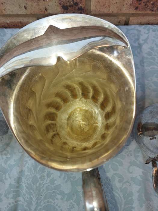 A COLLECTION OF WATER JUGS SOLD AS IS