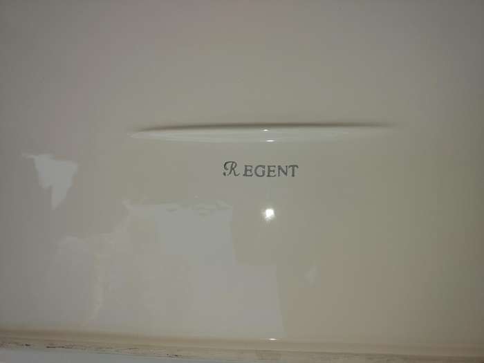 A COLLECTION OF WHITE PORCELAIN PLATTERS SOLD AS IS