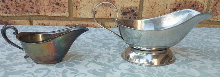 TWO VINTAGE SAUCE JUGS SOLD AS IS