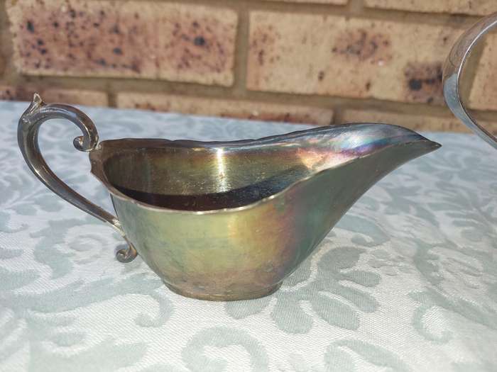 TWO VINTAGE SAUCE JUGS SOLD AS IS