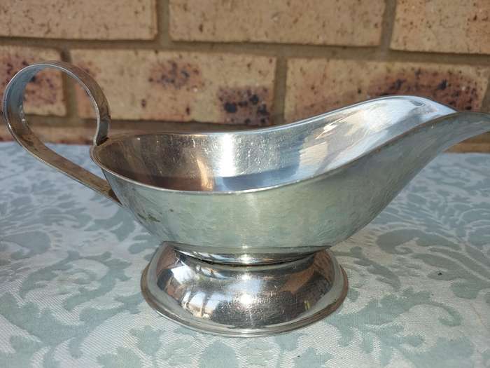 TWO VINTAGE SAUCE JUGS SOLD AS IS