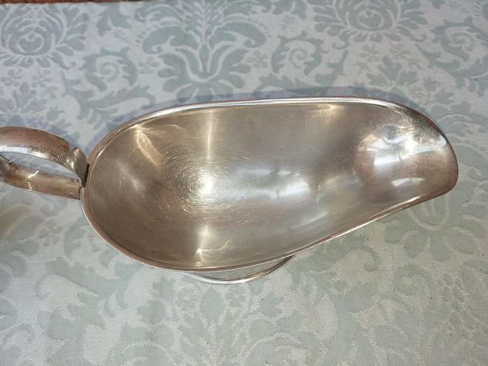 TWO VINTAGE SAUCE JUGS SOLD AS IS