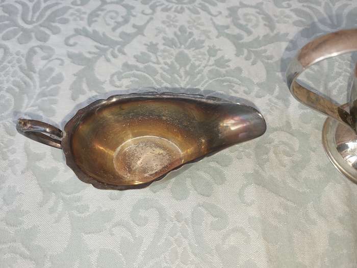 TWO VINTAGE SAUCE JUGS SOLD AS IS