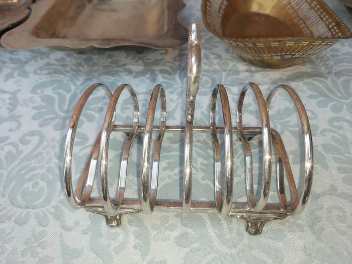 AN ENTIRE COLLECTION OF EPNS WEDDING SERVING BASKETS AND KITCHEN UNTENSILS SOLD AS IS