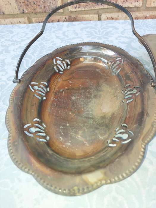 AN ENTIRE COLLECTION OF EPNS WEDDING SERVING BASKETS AND KITCHEN UNTENSILS SOLD AS IS