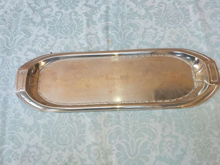A SILVER PLATED RECTANGULAR SERVING PLATER SOLD AS IS