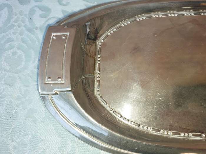 A SILVER PLATED RECTANGULAR SERVING PLATER SOLD AS IS