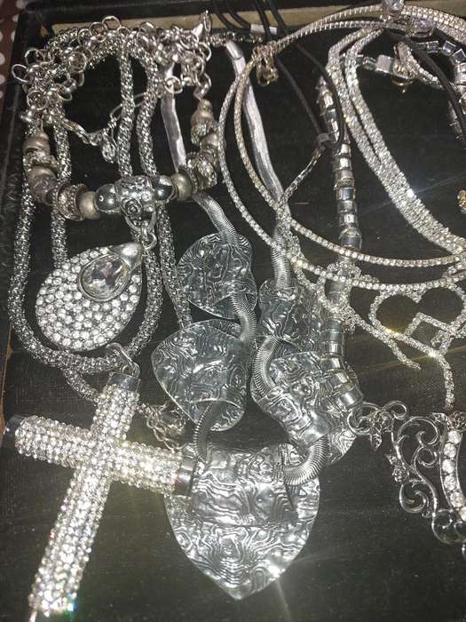 A COLLECTION SILVERPLATED COSTUME NECKLACES SOLD AS IS