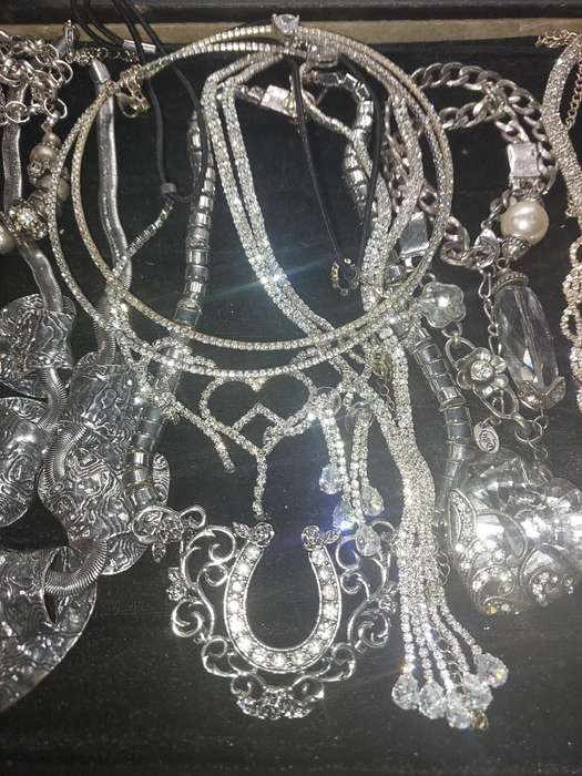 A COLLECTION SILVERPLATED COSTUME NECKLACES SOLD AS IS