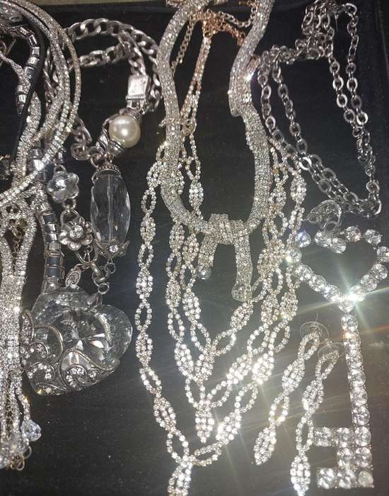 A COLLECTION SILVERPLATED COSTUME NECKLACES SOLD AS IS