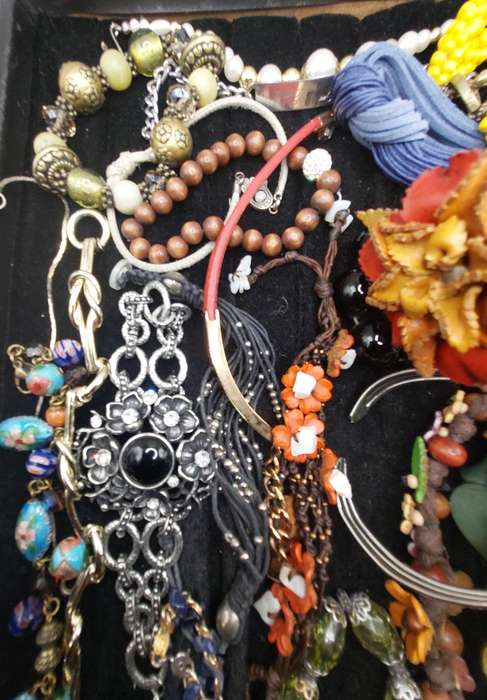 A collection of costume bangles and bracelets sold as is