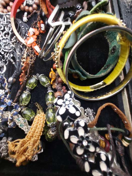 A collection of costume bangles and bracelets sold as is