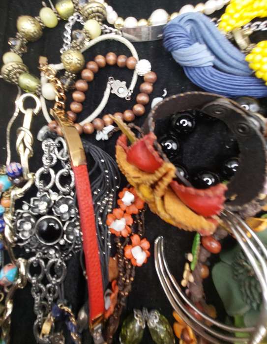 A collection of costume bangles and bracelets sold as is