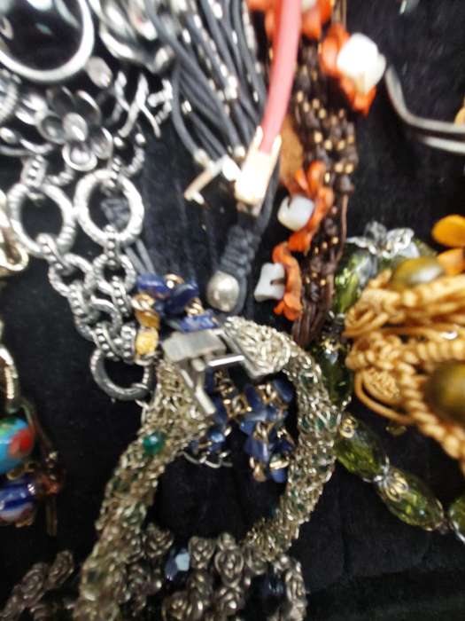 A collection of costume bangles and bracelets sold as is