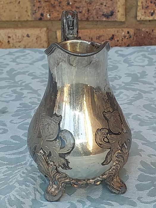 AN ANTIQUE DICKSON AND SONS SHEFFIELD ENGRAVED JUG SOLD AS IS