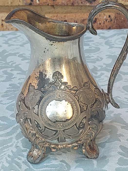 AN ANTIQUE DICKSON AND SONS SHEFFIELD ENGRAVED JUG SOLD AS IS