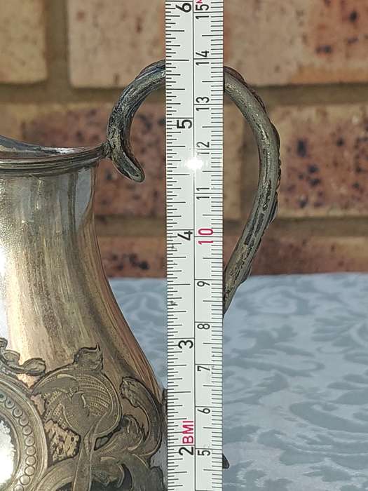 AN ANTIQUE DICKSON AND SONS SHEFFIELD ENGRAVED JUG SOLD AS IS