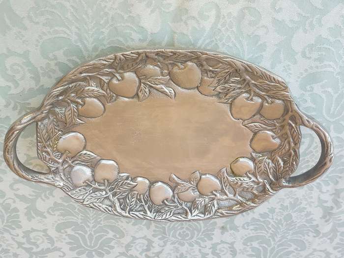 AN OVAL PEWTAL SERVING PLATTER SOLD AS IS