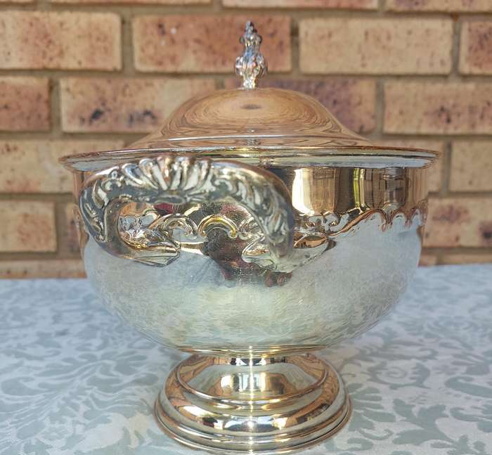 A SIVERPLATED TUREEN SOLD AS IS