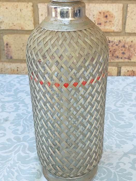 A VINTAGE SPARKLING WATER MAKER WITH WIRE MESH SOLD AS IS
