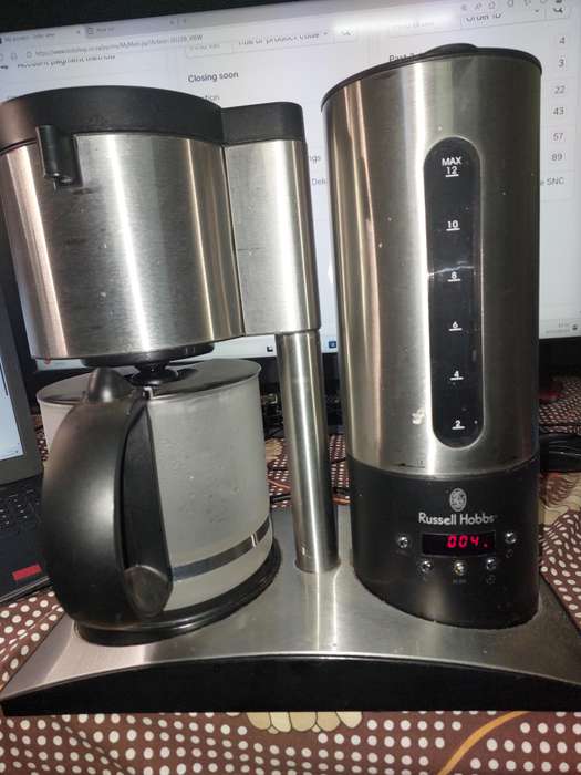 A RUSSEL HOBBS COFFEE MAKER IN WORKING CONDITION SOLD AS IS