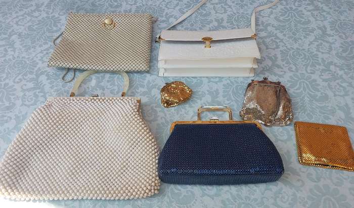 A COLLECTION OF HAND BAGS AND PURSES SOLD AS IS