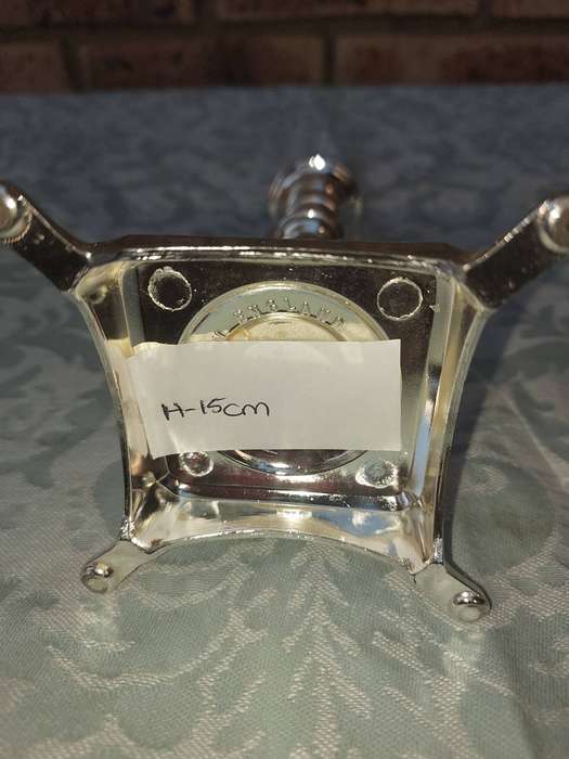 A PAIR OF ART DECOR CANDLE STANDS SOLD S IS