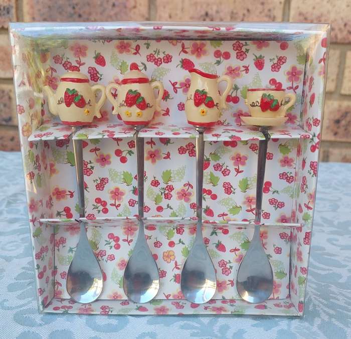 A SET OF ART DECOR TEASPOONS SOLD AS IS