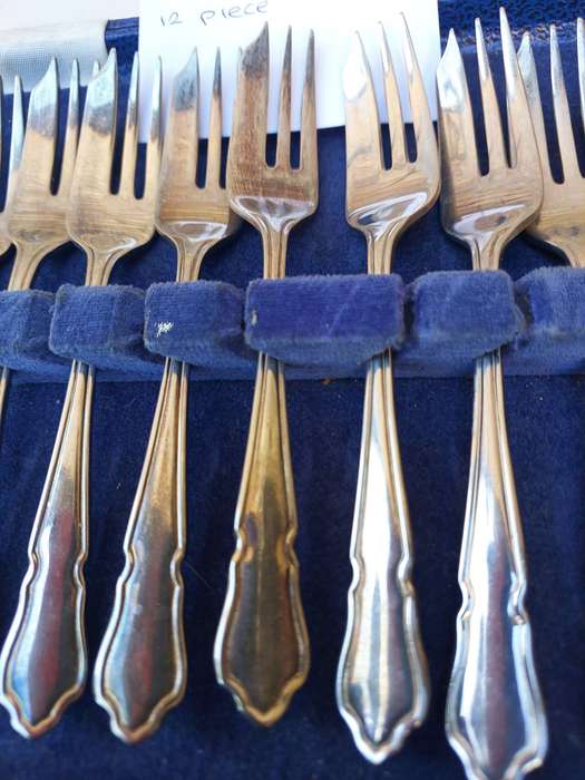 A SET OF 12 EPNS SHEFFIELD CAKE FORKS SOLD AS IS