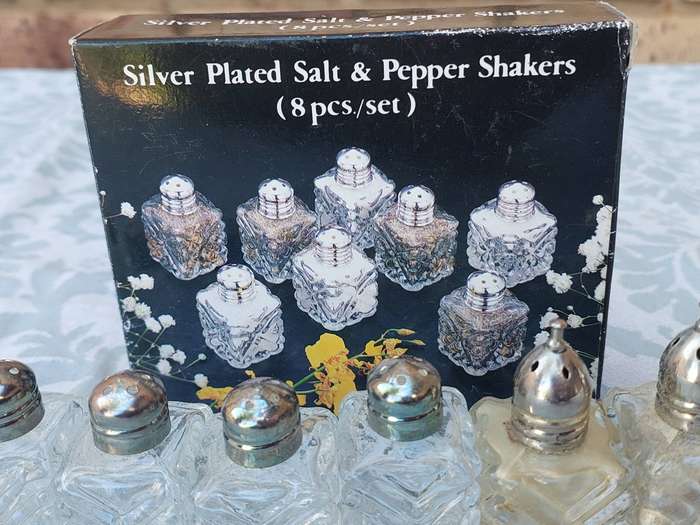 A SET OF 8 SALT AND PEPPER SHAKERS SOLD AS IS