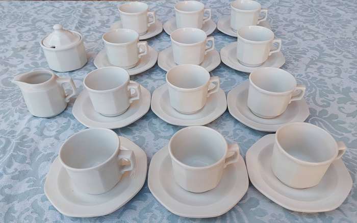 A COLLECTION OF EXPRESSO COFFEE CUPS AND SAUCERS