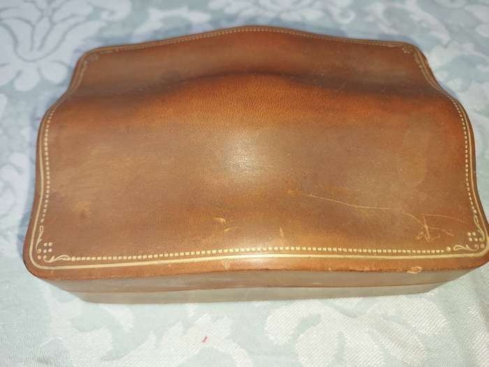 A COLLECTION OF VINTAGE LEATHER-BOUND JEWELRY BOXES SOLD AS IS