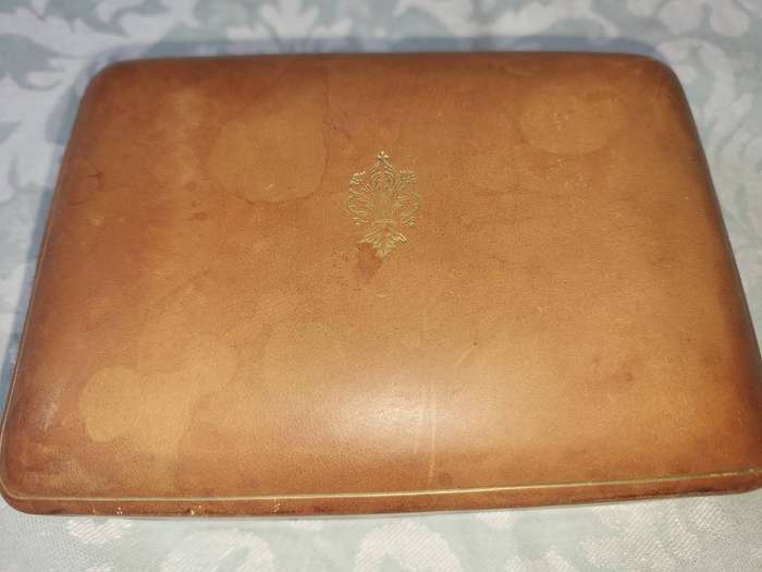 A COLLECTION OF VINTAGE LEATHER-BOUND JEWELRY BOXES SOLD AS IS