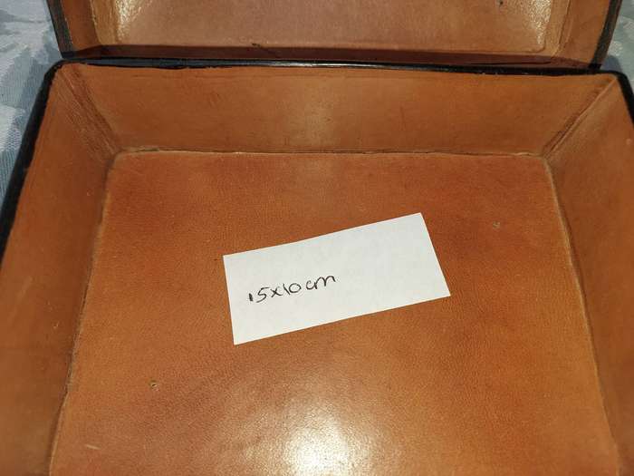 A COLLECTION OF VINTAGE LEATHER-BOUND JEWELRY BOXES SOLD AS IS