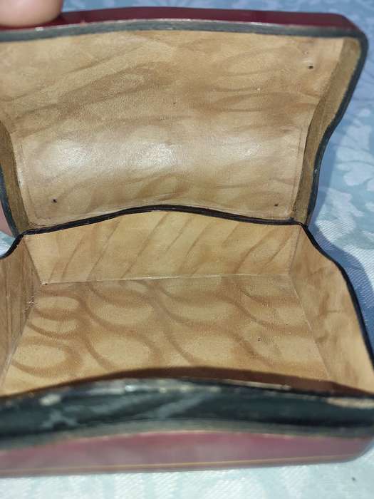 A COLLECTION OF VINTAGE LEATHER-BOUND JEWELRY BOXES SOLD AS IS