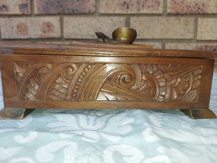 AN ART DECOR WOODEN JEWELRY BOX SOLD AS IS
