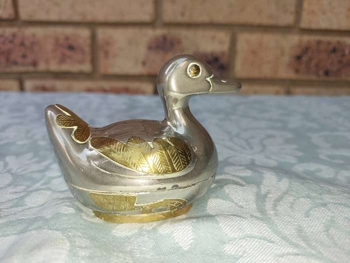 A BEAUTIFUL SILVER PLATE WITH GOLD-PLATED SIDE SALT DISPENSER DUCK SOLD AS IS