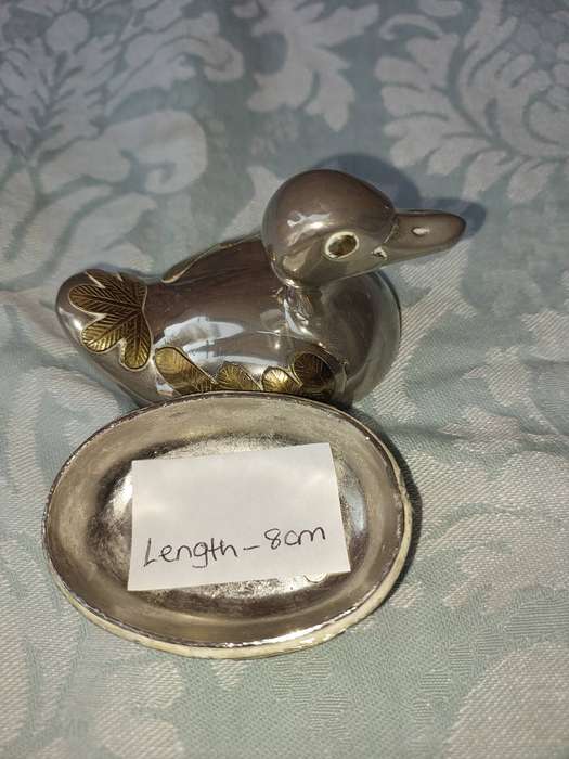 A BEAUTIFUL SILVER PLATE WITH GOLD-PLATED SIDE SALT DISPENSER DUCK SOLD AS IS