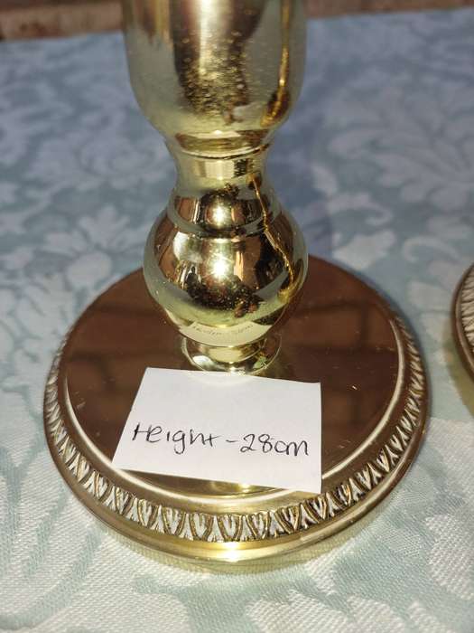 A SET OF BRASS ART DECOR CANDLE STANDS SOLD AS IS