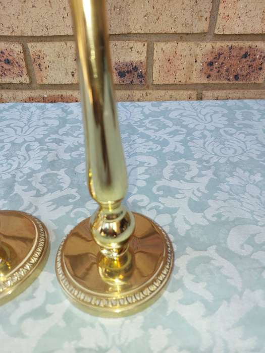 A SET OF BRASS ART DECOR CANDLE STANDS SOLD AS IS
